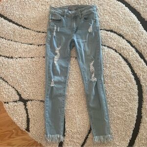 Distressed fringe jeans